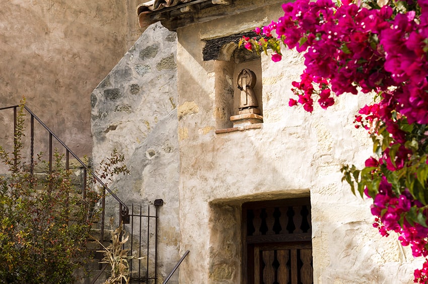 a doorway and stairs at the Carmel Mission in Carmel, Ca.